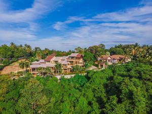 an aerial view of a resort on a hill at Bell Seaside Luxury Villa in Rawai Beach
