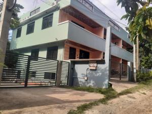 a building with a gate in front of it at Two-Storey Townhouse in Laguindingan