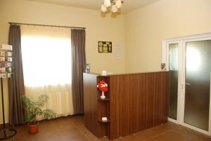 a hospital room with a reception desk and a window at Hotel Liliacul in Cluj-Napoca
