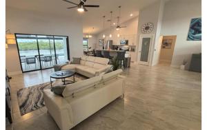 a living room with a couch and a table at Sandi Villa in Cape Coral