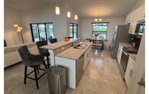 a kitchen with a sink and a counter top at Sandi Villa in Cape Coral