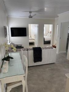 a living room with a couch and a table at Seascape in Dwarskersbos