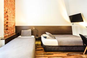 Posteľ alebo postele v izbe v ubytovaní St. Dorothys hostel - apartments