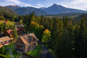 an aerial view of a house in the mountains at Platanus by Hotel Pieris in Pribylina +42 photos