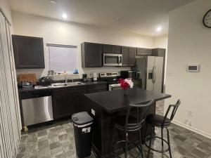 a kitchen with a table and a counter top at Inner Haven Family Homes in Indianapolis