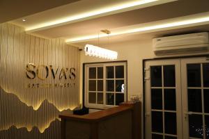 an office with a desk and a sign on the wall at Sovas Nature Hideout in Kolvan +52 photos