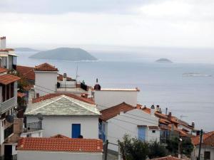 a view of roofs of houses and the ocean at Dimitra's House in Glossa +42 photos