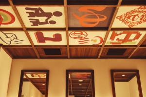 a room with signs on the ceiling of a building at Hotel Indigo Hakone Gora by IHG in Hakone +174 photos