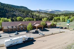 an aerial view of a building with a rv parked in a parking lot at Quality Inn & Suites South Fork - Wolf Creek in South Fork