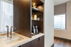 a kitchen with a sink and a window at Cambria Hotel Houston Downtown Convention Center in Houston +59 photos