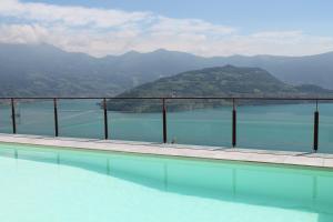 a swimming pool with a view of a mountain at Vista Paradiso in Parzanica