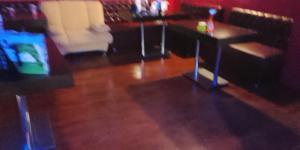 a room with chairs and a table in a room at Кащта за гости АРДА in Kŭrdzhali