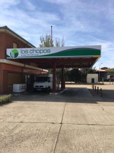 a gas station with a truck parked in front at Hostal Los Chopos in Osorno