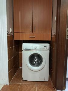a washer and dryer in a small room at Twin Double X2 Room in Istanbul
