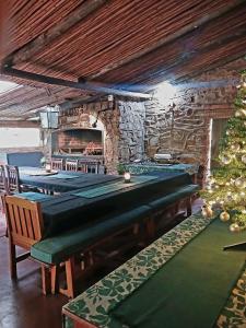 a room with several pool tables and a christmas tree at Paardeplaats Nature Retreat in Lydenburg