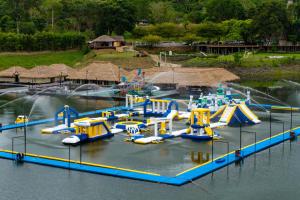 a water park with a bunch of rides in the water at Ruknam Resort in Ban Hin Hak