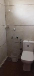 a bathroom with a toilet and a shower at FORA Inn in Cochin
