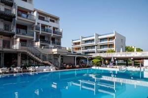 a large swimming pool next to a building at Hotel La Villa in Martinsicuro +136 photos