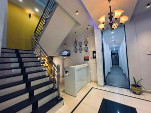 a staircase in a building with a lobby at Kanha Gold in Bhopal