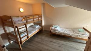 a small room with two bunk beds in it at Aupalya Gîte Le Logis Catalan in Font-Romeu