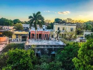 an aerial view of a city with a house at Casa Bahareque Merida in Mérida