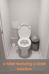 a toilet featuring a bidet function in a bathroom at Cozy Nook in Valencia +13 photos