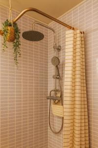 a shower in a bathroom with a shower curtain at RelaxMaria in Sant Carles de la Ràpita +19 photos
