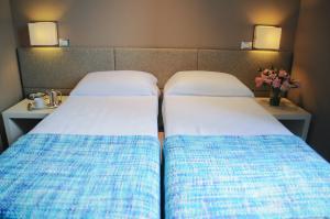 Postel nebo postele na pokoji v ubytování B&B Carini 58