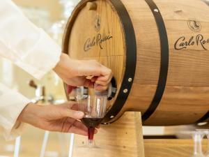 a person is pouring wine into a wine glass at KAMENOI HOTEL Ichinoseki in Ichinoseki