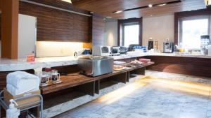 a kitchen with a counter with food on it at Center Hotel Toyota in Toyota