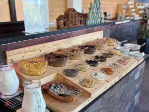 a buffet with many different types of food in baskets at Platanus by Hotel Pieris in Pribylina