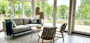a living room with a couch and a table at Lilla Brattön in Myggenäs