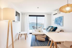 a living room with a couch and a table at Eurostars Ibiza in Ibiza Town