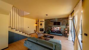 a living room with a couch and a tv at Villa Lana by Villas Guide in Vela Luka