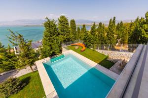 an overhead view of a swimming pool in a villa at Lake Whisper Villa Pool & Amazing Views by PikHost in Shirokë