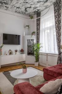 a living room with a couch and a table at NEBarrabona in Győr