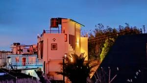 a building with a lighthouse on top of it at GRETZbnb in Shillong