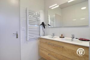 a bathroom with a sink and a mirror and a shower at Le clos du bas in Noyal-Muzillac +17 photos