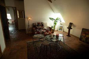 a living room with a couch and a table at Les hauts des Soussilanges in Céron