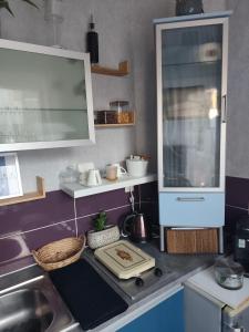 a kitchen with a sink and a counter top at Villa Seven Petit Studio coin kitchenette in Dunkerque +3 photos