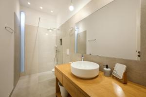 a bathroom with a white sink and a mirror at Deluxe Apartment Talia by Irundo in Zagreb