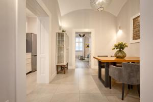a kitchen and dining room with a table and a dining room gmaxwell gmaxwell at Deluxe Apartment Talia by Irundo in Zagreb