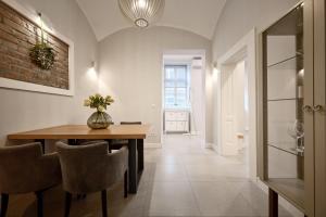 a dining room with a table and chairs at Deluxe Apartment Talia by Irundo in Zagreb