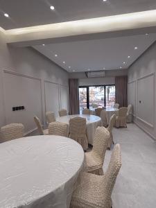 a meeting room with tables and chairs in it at A big house -Isteraha- in Malham +26 photos