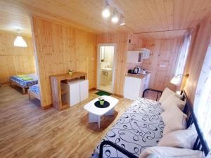 a living room with a couch and a table at Elmona Villas in Kamchia
