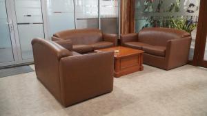 a waiting room with two chairs and a table at Kara Guest House AA1 in Batam Center