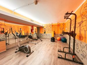 a gym with exercise equipment in a room at Ostello Bello Genova in Genoa