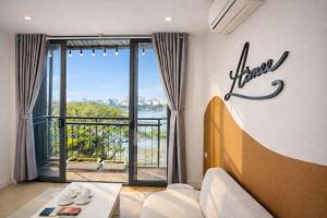 a living room with a view of the water at AimeeHouse - Trích Sài in Hanoi