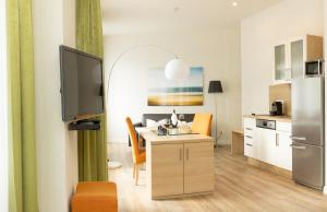 Kuchyň nebo kuchyňský kout v ubytování Apartmenthotel Kaiser Karl
