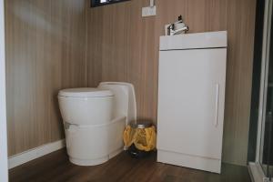 a small bathroom with a toilet in a room at Pigeon Pair Tiny Houses by Tiny Away in Tallarook +9 photos